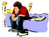 Man sitting on his bed, with his Bible, praying.